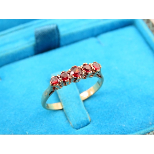 343 - Five Stone Garnet Set Ring Mounted on 9 Carat Yellow Gold Band Ring Size P