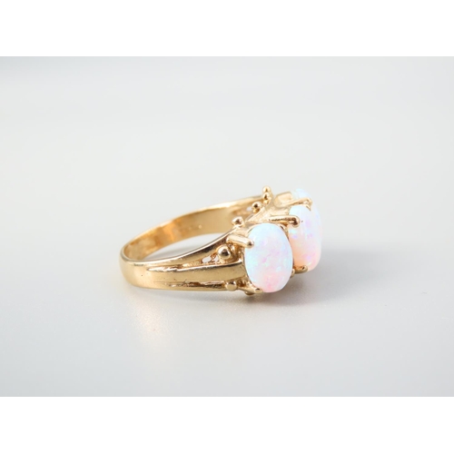 345 - Opal Three Stone Ring Mounted on 9 Carat Yellow Gold Band Ring Size O and a Half