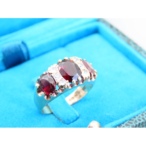 352 - Three Stone Garnet Ladies Ring Mounted on 9 Carat Yellow Gold Band Ring Size N