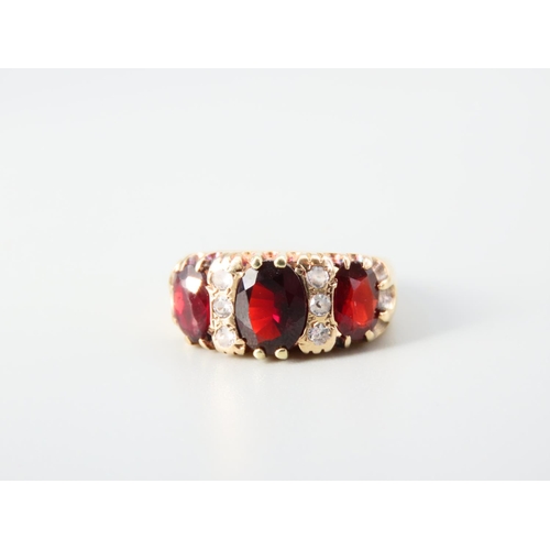 352 - Three Stone Garnet Ladies Ring Mounted on 9 Carat Yellow Gold Band Ring Size N