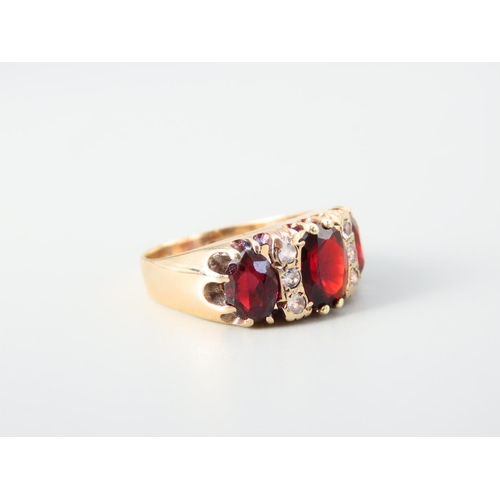 352 - Three Stone Garnet Ladies Ring Mounted on 9 Carat Yellow Gold Band Ring Size N