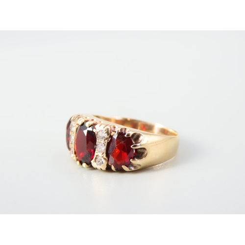 352 - Three Stone Garnet Ladies Ring Mounted on 9 Carat Yellow Gold Band Ring Size N