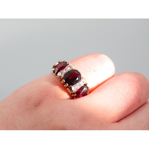 352 - Three Stone Garnet Ladies Ring Mounted on 9 Carat Yellow Gold Band Ring Size N