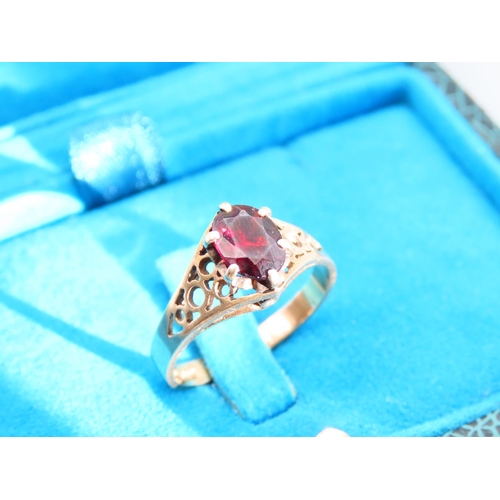 356 - Red Garnet Ladies Centre Stone Ring Claw Set Mounted on 9 Carat Yellow Gold Band Ring Size N