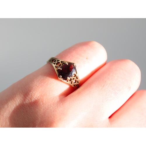 356 - Red Garnet Ladies Centre Stone Ring Claw Set Mounted on 9 Carat Yellow Gold Band Ring Size N