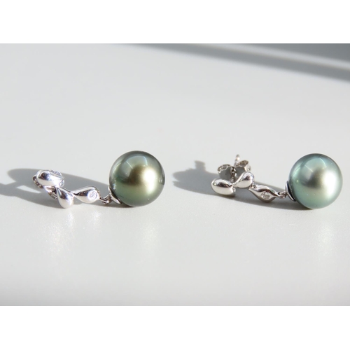 409 - Pair of Pearl Set and Diamond Decorated 9 Carat White Gold Drop Earrings Each 2cm High