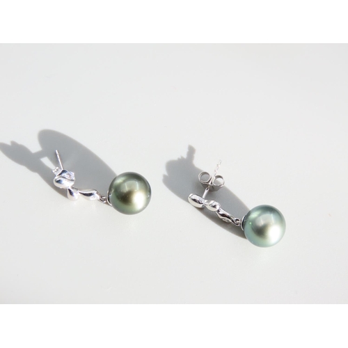 409 - Pair of Pearl Set and Diamond Decorated 9 Carat White Gold Drop Earrings Each 2cm High