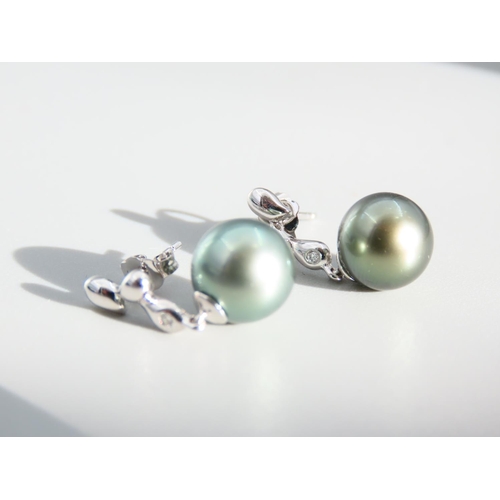 409 - Pair of Pearl Set and Diamond Decorated 9 Carat White Gold Drop Earrings Each 2cm High