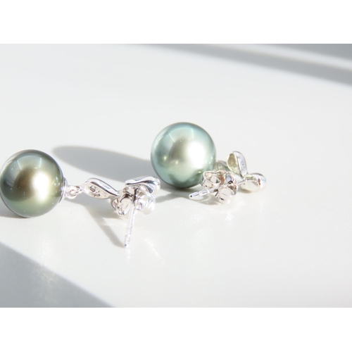 409 - Pair of Pearl Set and Diamond Decorated 9 Carat White Gold Drop Earrings Each 2cm High