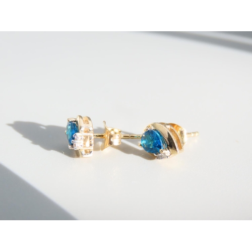 414 - Pair of Blue Topaz and Diamond Set Ladies Earrings Mounted in 9 Carat Yellow Gold