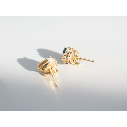 414 - Pair of Blue Topaz and Diamond Set Ladies Earrings Mounted in 9 Carat Yellow Gold