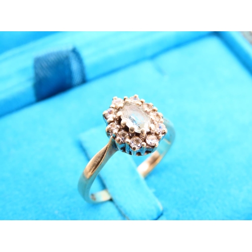 429 - Aquamarine Ladies Cluster Ring Mounted on 9 Carat Yellow Gold Band Ring Size L and a Half