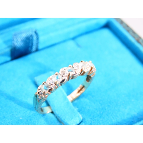 438 - Aquamarine and Diamond Ladies Band Ring Mounted on 9 Carat Yellow Gold Ring Size O