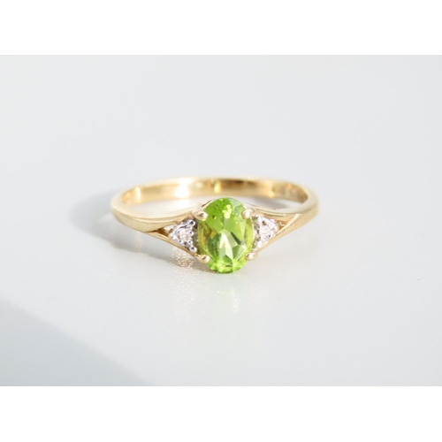 473 - Peridot and Diamond Ladies Centre Stone Ring Mounted on 9 Carat Yellow Gold Band Ring Size O