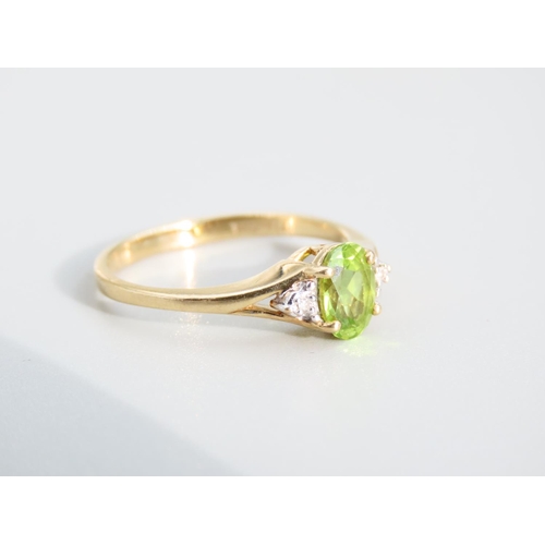 473 - Peridot and Diamond Ladies Centre Stone Ring Mounted on 9 Carat Yellow Gold Band Ring Size O