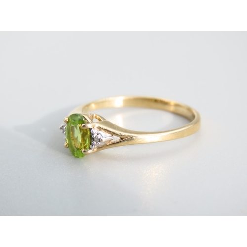 473 - Peridot and Diamond Ladies Centre Stone Ring Mounted on 9 Carat Yellow Gold Band Ring Size O