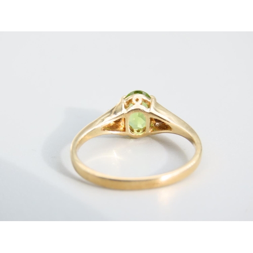 473 - Peridot and Diamond Ladies Centre Stone Ring Mounted on 9 Carat Yellow Gold Band Ring Size O