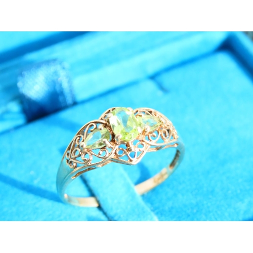 476 - Peridot Three Stone 9 Carat Yellow Gold Ring Attractively Detailed Ring Size S and a Half