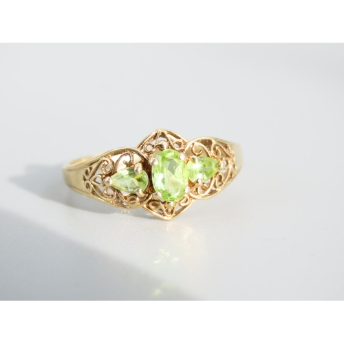 476 - Peridot Three Stone 9 Carat Yellow Gold Ring Attractively Detailed Ring Size S and a Half