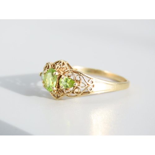 476 - Peridot Three Stone 9 Carat Yellow Gold Ring Attractively Detailed Ring Size S and a Half