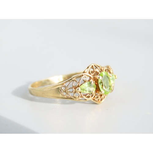 476 - Peridot Three Stone 9 Carat Yellow Gold Ring Attractively Detailed Ring Size S and a Half