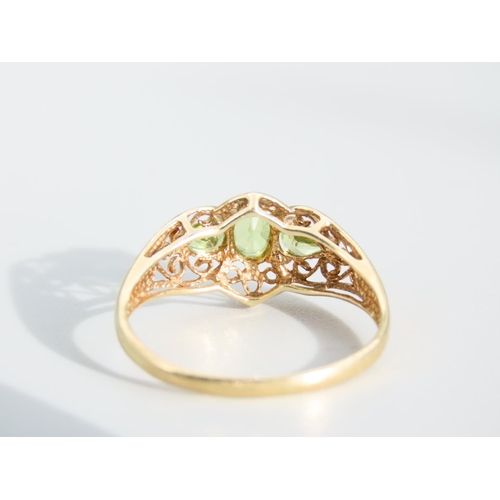 476 - Peridot Three Stone 9 Carat Yellow Gold Ring Attractively Detailed Ring Size S and a Half