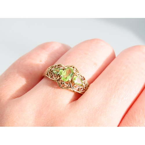 476 - Peridot Three Stone 9 Carat Yellow Gold Ring Attractively Detailed Ring Size S and a Half