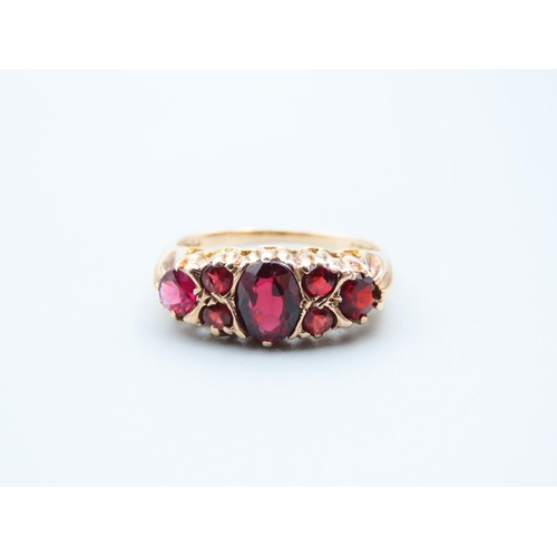 88 - Garnet Set Ladies 9 Carat Yellow Gold Ring Size Q and a Half