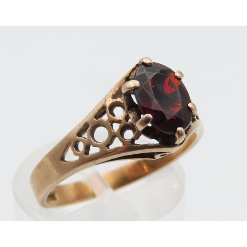 1078 - Red Garnet Ladies Centre Stone Ring Claw Set Mounted on 9 Carat Yellow Gold Band Ring Size N