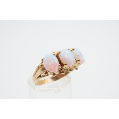 1091 - Opal Three Stone Ring Mounted on 9 Carat Yellow Gold Band Ring Size O and a Half