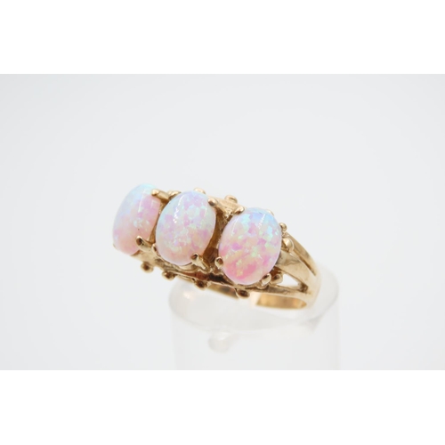 1091 - Opal Three Stone Ring Mounted on 9 Carat Yellow Gold Band Ring Size O and a Half