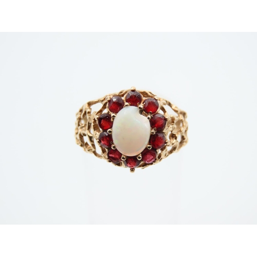 1100 - Opal and Red Garnet Cluster Ring Mounted on Detailed Yellow Gold Band Ring Size O