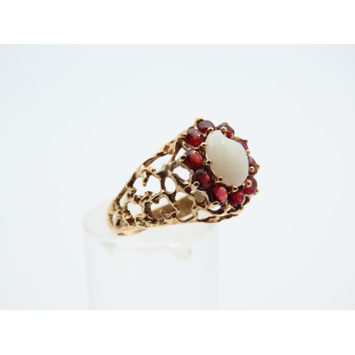 1100 - Opal and Red Garnet Cluster Ring Mounted on Detailed Yellow Gold Band Ring Size O