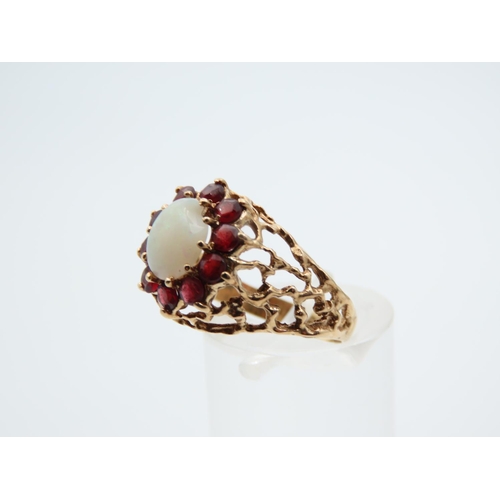 1100 - Opal and Red Garnet Cluster Ring Mounted on Detailed Yellow Gold Band Ring Size O