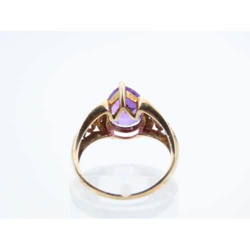 1109 - Amethyst and Diamond Centre Stone Ring Pear Cut Mounted on 9 Carat Yellow Gold Band Size N and a Hal... 