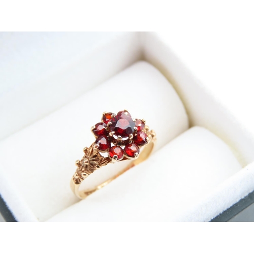 1122 - Garnet Cluster Ring Mounted on 9 Carat Yellow Gold Band Ring Size L