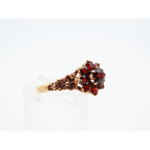 1122 - Garnet Cluster Ring Mounted on 9 Carat Yellow Gold Band Ring Size L