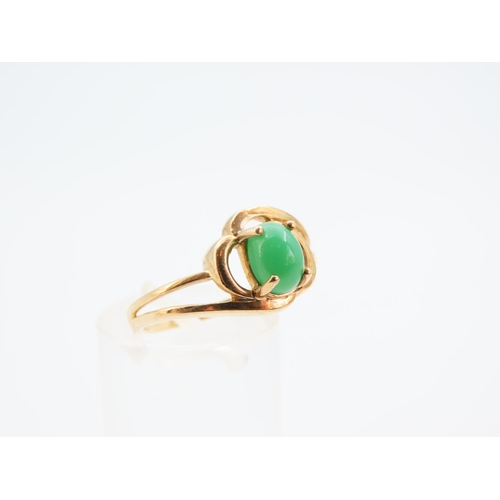 1142 - Polished Cabochon Cut Jade Center Stone Ring Mounted on 9 Carat Yellow Gold Band