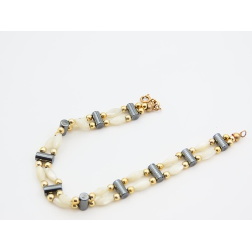 1151 - Mother of Pearl Twin Row 9 Carat Yellow Gold Mounted Ladies Bracelet of Articulated Form 17.5cm Long