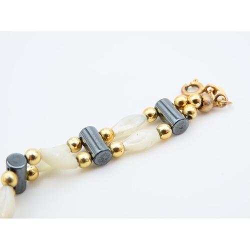 1151 - Mother of Pearl Twin Row 9 Carat Yellow Gold Mounted Ladies Bracelet of Articulated Form 17.5cm Long