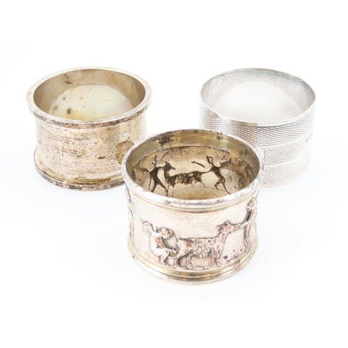 1162 - Three Silver Napkin Rings One with Cherub Motif Detailed