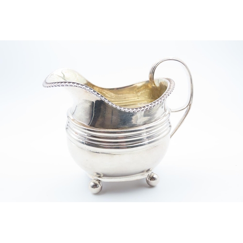 1188 - Silver Milk Jug Bun Form Supports Egg and Dart Rim Flying C Scroll Handle 11cm High