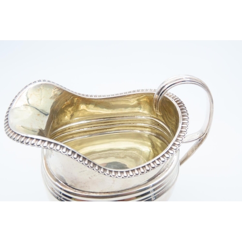 1188 - Silver Milk Jug Bun Form Supports Egg and Dart Rim Flying C Scroll Handle 11cm High