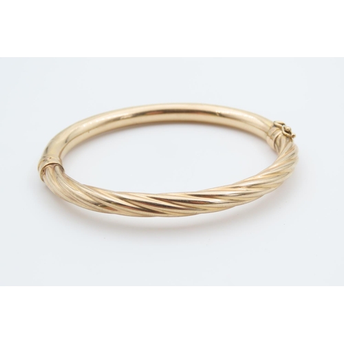 1217 - 9 Carat Yellow Gold Twist Form Ladies Bangle Inner Diameter 6.5cm