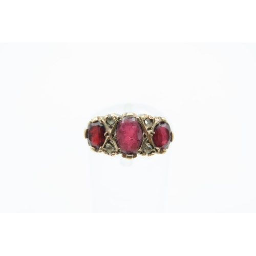 1219 - Garnet Three Stone Ring Mounted on 9 Carat Yellow Gold Band Ring Size M