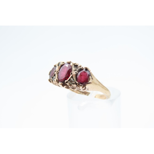 1219 - Garnet Three Stone Ring Mounted on 9 Carat Yellow Gold Band Ring Size M