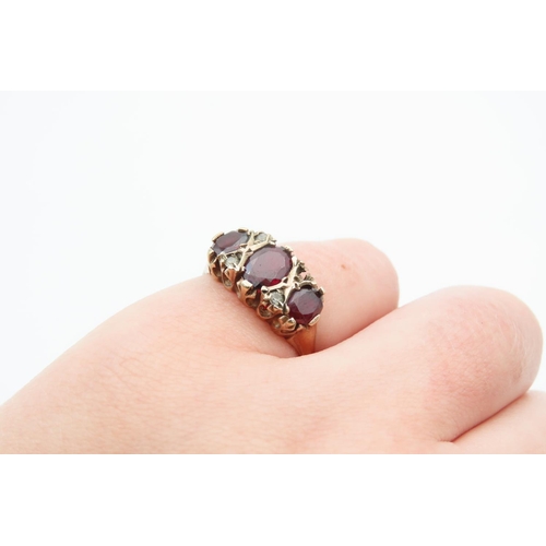 1219 - Garnet Three Stone Ring Mounted on 9 Carat Yellow Gold Band Ring Size M