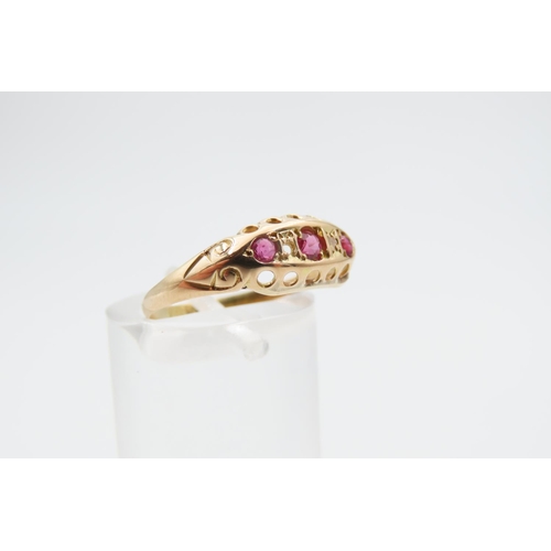 1226 - 18 Carat Yellow Gold Ruby Three Stone Ring Size L and a Half