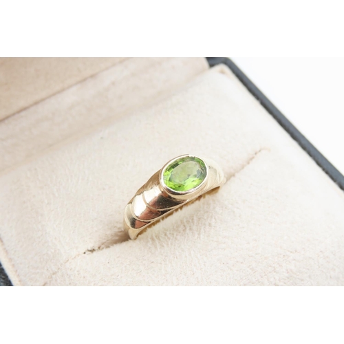 1275 - Peridot Centre Stone Ring Mounted on 9 Carat Yellow Gold Band Rub Over Setting Size O and a Half