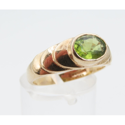 1275 - Peridot Centre Stone Ring Mounted on 9 Carat Yellow Gold Band Rub Over Setting Size O and a Half